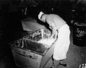 Baker from the 6th NCB kneads dough by hand on Guadalcanal